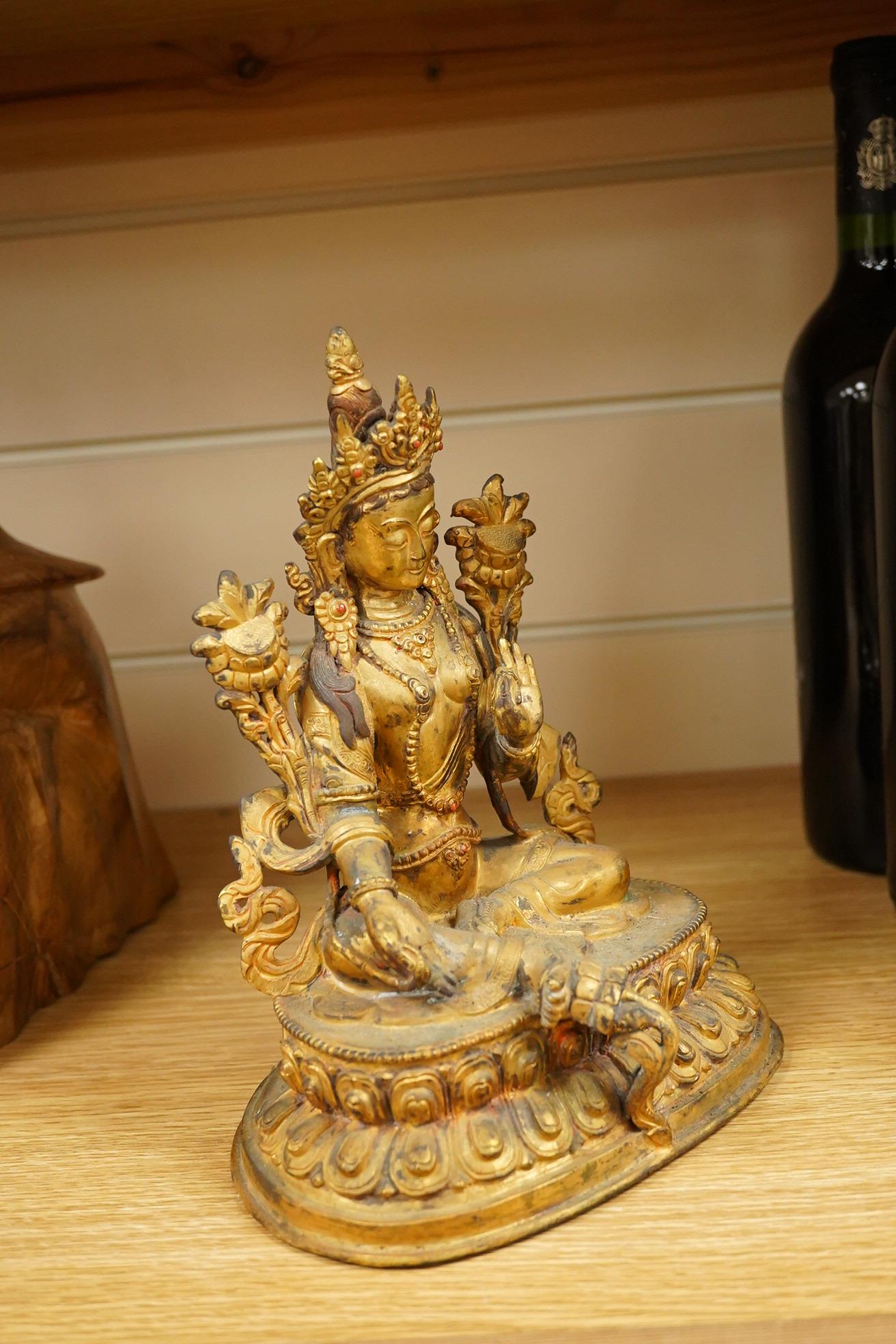 A Sino Tibetan gilt bronze figure of Green Tara, 23cm high